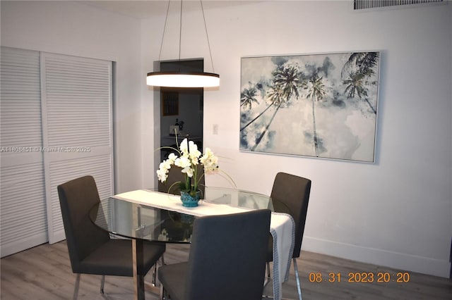 3901 S Ocean Dr Unit 11A, Hollywood, FL 33019 - dining room with wood finished floors and baseboards