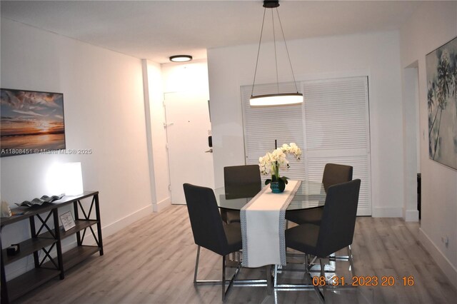 3901 S Ocean Dr Unit 11A, Hollywood, FL 33019 - dining room with wood finished floors and baseboards