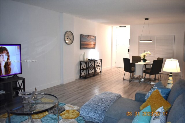 3901 S Ocean Dr Unit 11A, Hollywood, FL 33019 - living area with wood finished floors and baseboards