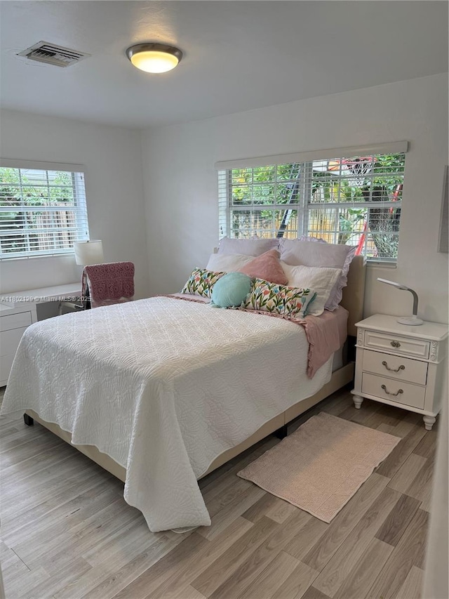 4441 NE 17th Ave, Oakland Park, FL 33334 - bedroom featuring light wood-type flooring