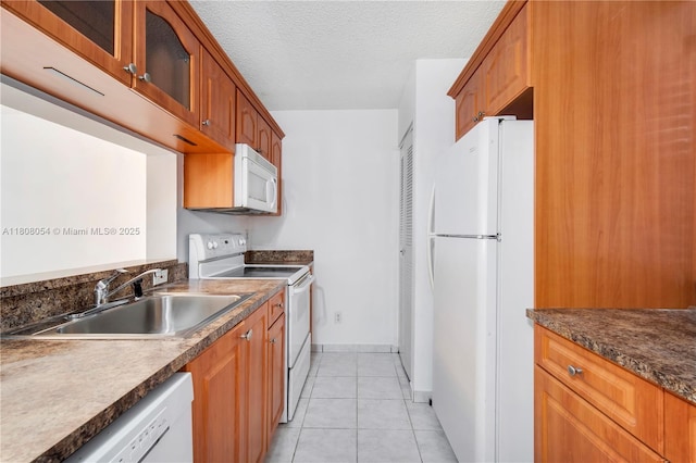 11604 NW 11th St, Pembroke Pines, FL 33026 - kitchen featuring white appliances, a sink, glass insert cabinets, baseboards, and light tile patterned flooring