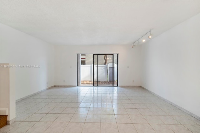 11604 NW 11th St, Pembroke Pines, FL 33026 - unfurnished room with light tile patterned floors, baseboards, and track lighting