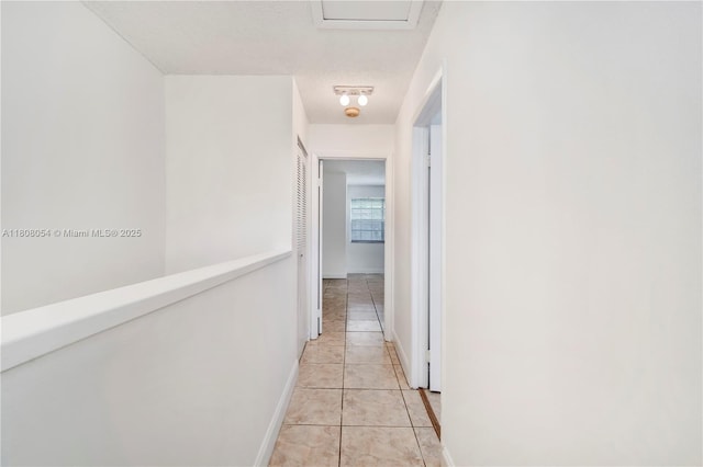 11604 NW 11th St, Pembroke Pines, FL 33026 - hallway with light tile patterned floors, a textured ceiling, and baseboards