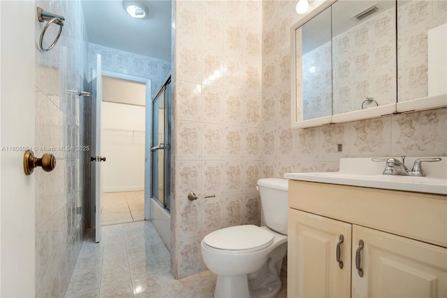 11604 NW 11th St, Pembroke Pines, FL 33026 - full bathroom featuring tile patterned flooring, vanity, toilet, and enclosed tub / shower combo