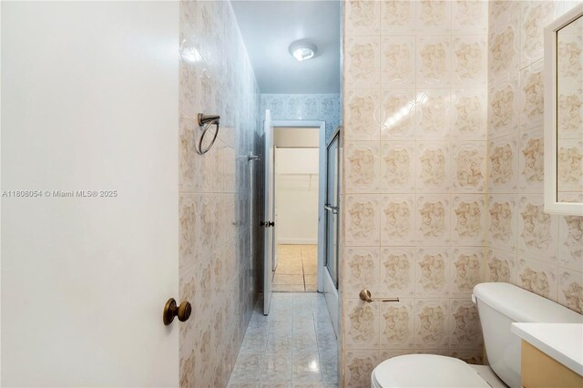 11604 NW 11th St, Pembroke Pines, FL 33026 - full bath with tile patterned flooring, toilet, vanity, a shower with shower door, and tile walls