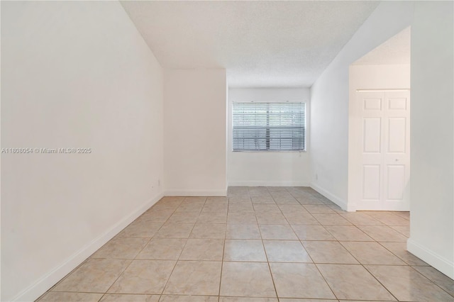 11604 NW 11th St, Pembroke Pines, FL 33026 - empty room with light tile patterned floors and baseboards