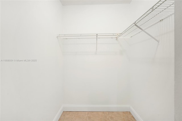 11604 NW 11th St, Pembroke Pines, FL 33026 - walk in closet featuring light tile patterned floors