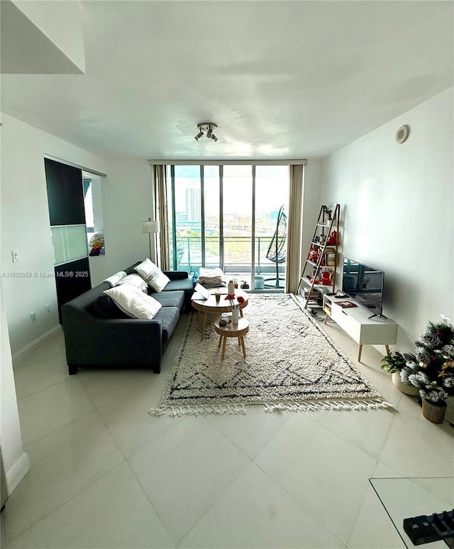 90 SW 3rd St Unit 1208, Miami, FL 33130 - living room featuring a wall of windows, baseboards, and tile patterned flooring