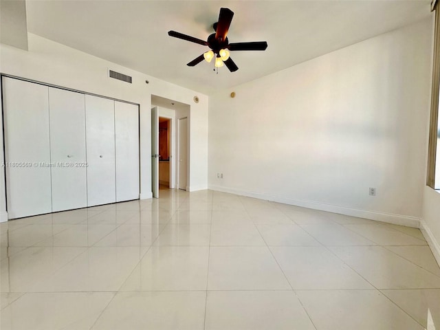 90 SW 3rd St Unit 1208, Miami, FL 33130 - unfurnished bedroom with light tile patterned floors, baseboards, a closet, and ceiling fan
