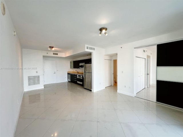 90 SW 3rd St Unit 1208, Miami, FL 33130 - unfurnished living room featuring baseboards