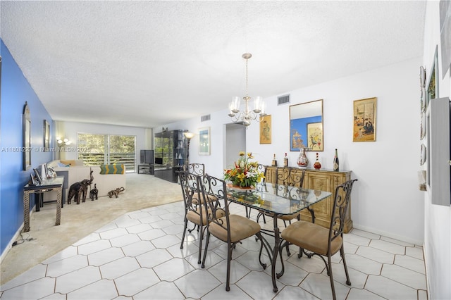 2504 Antigua Ter Unit O3, Coconut Creek, FL 33066 - dining room featuring a chandelier and a textured ceiling