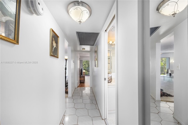 2504 Antigua Ter Unit O3, Coconut Creek, FL 33066 - hall featuring plenty of natural light and light tile patterned floors