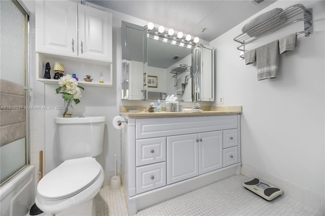 2504 Antigua Ter Unit O3, Coconut Creek, FL 33066 - full bathroom featuring vanity, toilet, tile patterned floors, baseboards, and shower / bath combination with glass door