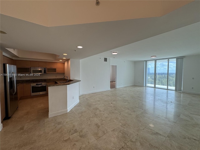 15051 Royal Oaks Ln Unit 1604, North Miami, FL 33181 - kitchen featuring appliances with stainless steel finishes, open floor plan, floor to ceiling windows, a sink, and a peninsula