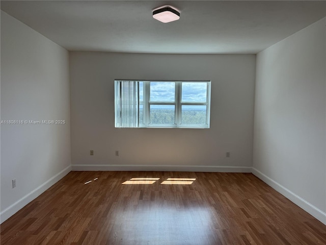 15051 Royal Oaks Ln Unit 1604, North Miami, FL 33181 - empty room with wood finished floors and baseboards