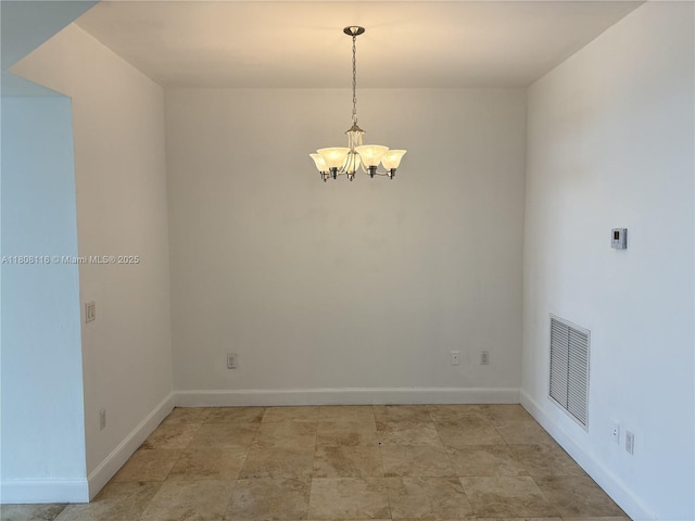15051 Royal Oaks Ln Unit 1604, North Miami, FL 33181 - empty room featuring a chandelier and baseboards