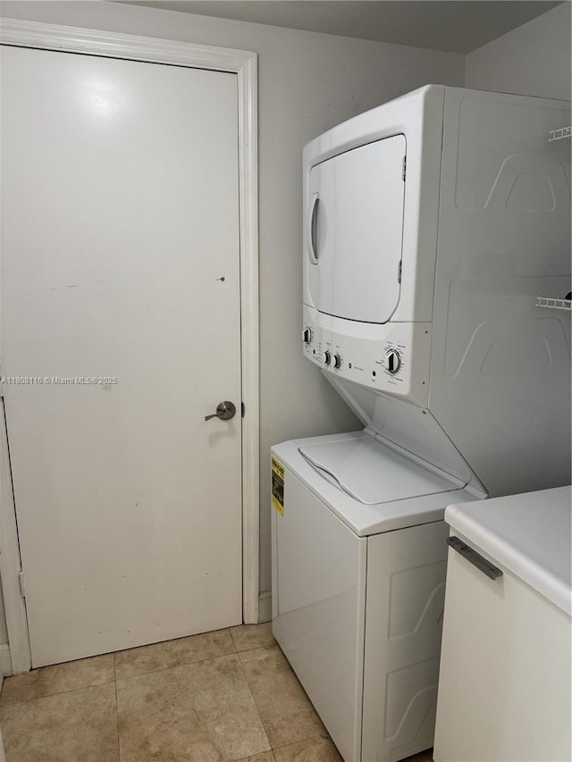 15051 Royal Oaks Ln Unit 1604, North Miami, FL 33181 - laundry area with estacked washer and dryer and light tile patterned floors