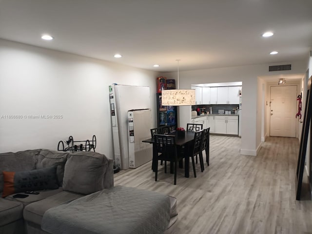 2005 Sans Souci Blvd Unit 202, North Miami, FL 33181 - living room featuring recessed lighting, light wood-style flooring, and baseboards