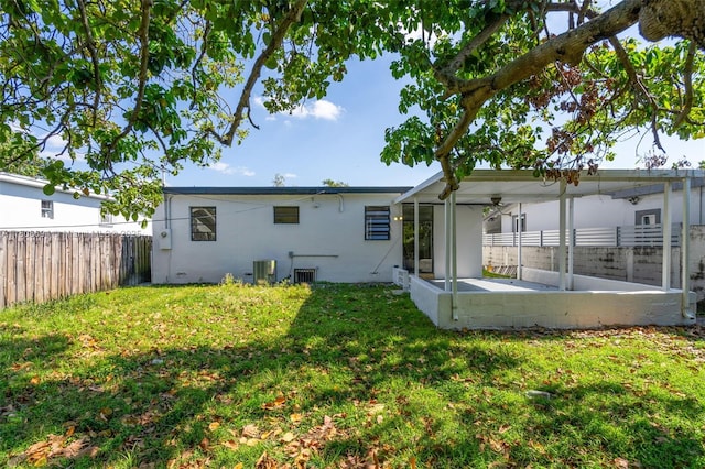 739 W 30th St, Hialeah, FL 33012 - rear view of house featuring central air condition unit and stucco siding