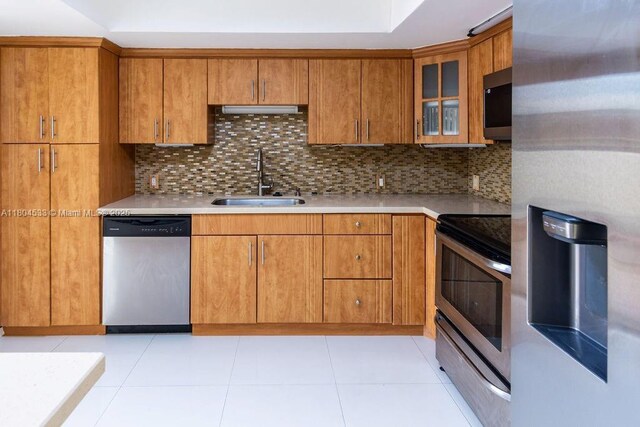 17359 NW 66th Ct, Hialeah, FL 33015 - kitchen with stainless steel appliances, a sink, decorative backsplash, and light countertops