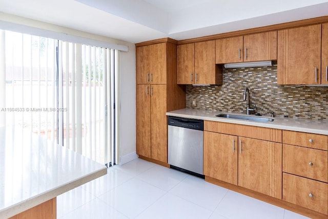 17359 NW 66th Ct, Hialeah, FL 33015 - kitchen with stainless steel dishwasher, a sink, decorative backsplash, brown cabinets, and light countertops