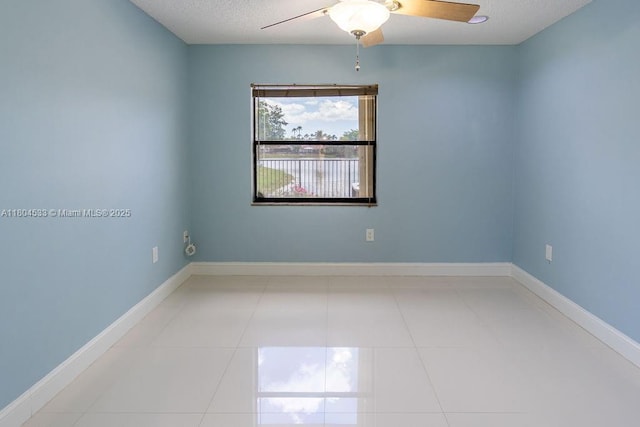 17359 NW 66th Ct, Hialeah, FL 33015 - empty room with a ceiling fan, tile patterned flooring, a textured ceiling, and baseboards