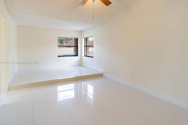 17359 NW 66th Ct, Hialeah, FL 33015 - unfurnished room featuring ceiling fan, tile patterned floors, a textured ceiling, and baseboards