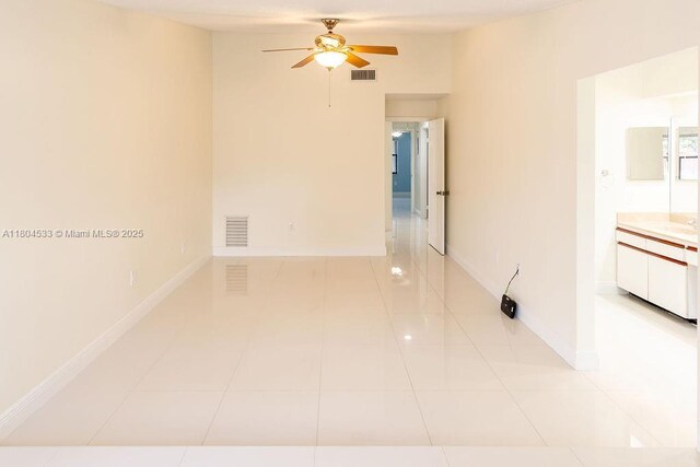 17359 NW 66th Ct, Hialeah, FL 33015 - spare room with ceiling fan, light tile patterned flooring, and baseboards
