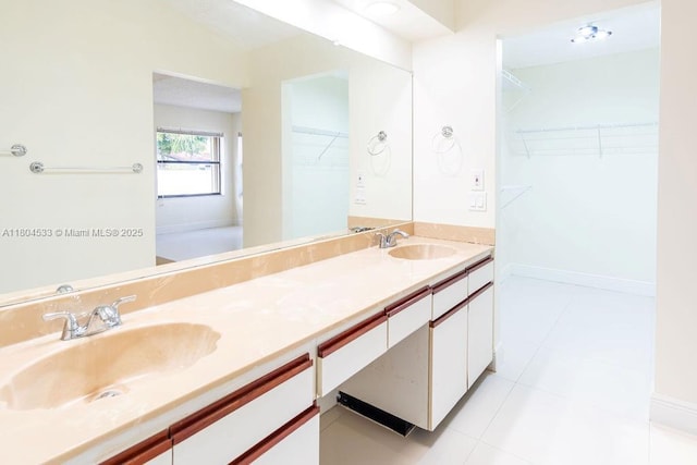 17359 NW 66th Ct, Hialeah, FL 33015 - bathroom featuring double vanity, tile patterned flooring, and a walk in closet