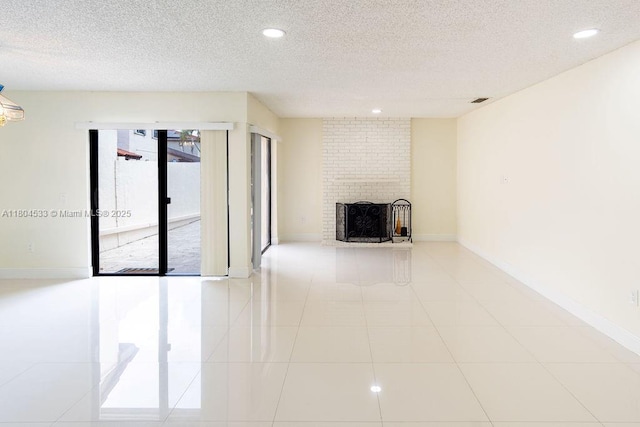 17359 NW 66th Ct, Hialeah, FL 33015 - unfurnished living room featuring recessed lighting, a textured ceiling, a brick fireplace, baseboards, and tile patterned floors