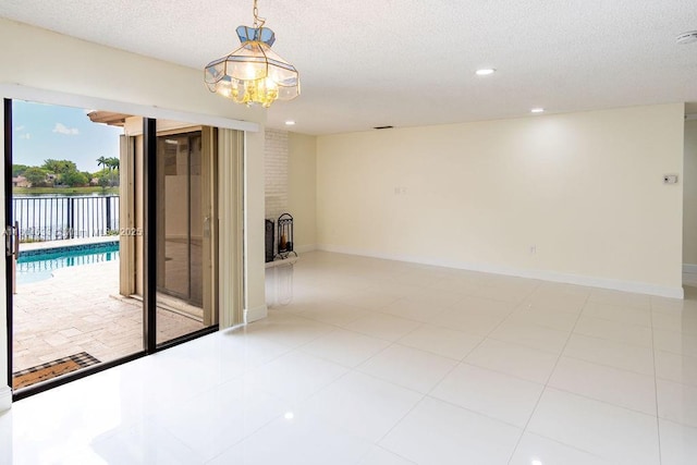 17359 NW 66th Ct, Hialeah, FL 33015 - unfurnished room with a textured ceiling, baseboards, recessed lighting, and a chandelier
