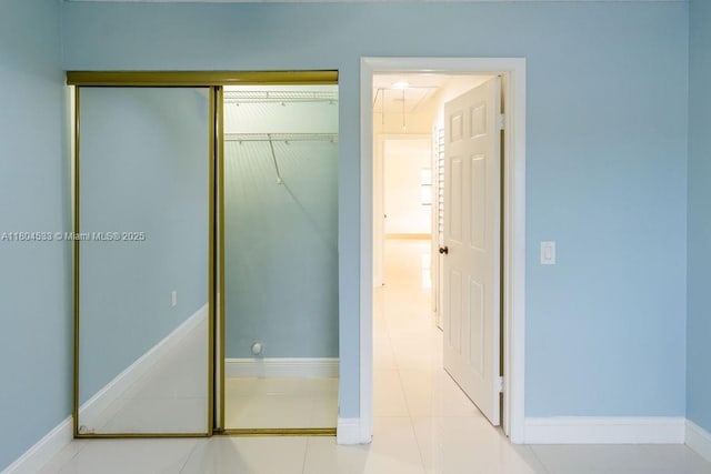17359 NW 66th Ct, Hialeah, FL 33015 - unfurnished bedroom featuring a closet, baseboards, and tile patterned flooring