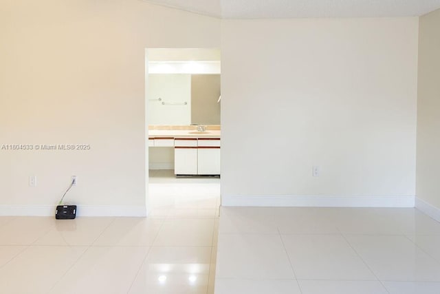 17359 NW 66th Ct, Hialeah, FL 33015 - tiled spare room featuring a sink and baseboards