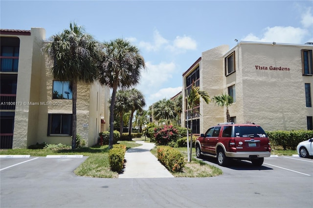 733 SE 1st Way Unit 206, Deerfield Beach, FL 33441 - view of property with uncovered parking