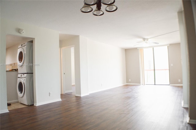 733 SE 1st Way Unit 206, Deerfield Beach, FL 33441 - unfurnished living room with stacked washer and clothes dryer, a ceiling fan, wood finished floors, and a chandelier