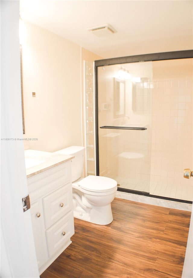 733 SE 1st Way Unit 206, Deerfield Beach, FL 33441 - bathroom with vanity, wood finished floors, and a tile shower