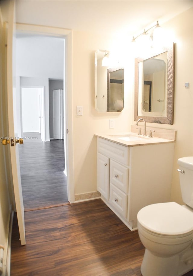 733 SE 1st Way Unit 206, Deerfield Beach, FL 33441 - bathroom featuring wood finished floors and vanity