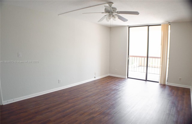 733 SE 1st Way Unit 206, Deerfield Beach, FL 33441 - spare room with a ceiling fan, dark wood-type flooring, and a wall of windows
