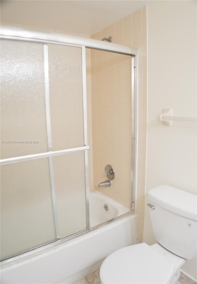 733 SE 1st Way Unit 206, Deerfield Beach, FL 33441 - bathroom with toilet and bath / shower combo with glass door