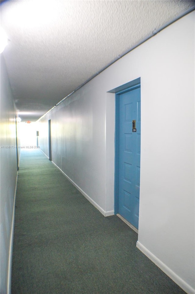 733 SE 1st Way Unit 206, Deerfield Beach, FL 33441 - hall with carpet flooring and a textured ceiling