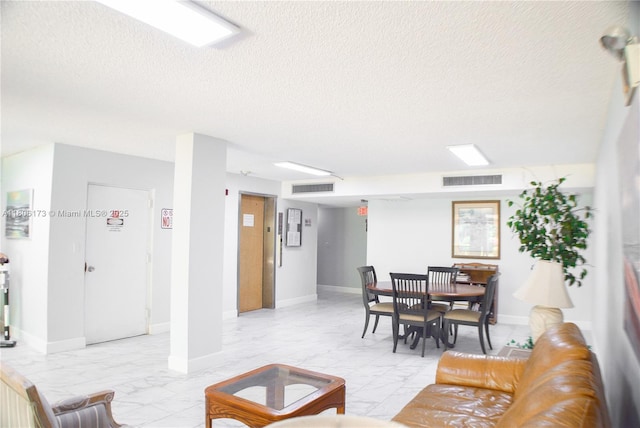 733 SE 1st Way Unit 206, Deerfield Beach, FL 33441 - living room featuring light marble finish flooring, a textured ceiling, and elevator