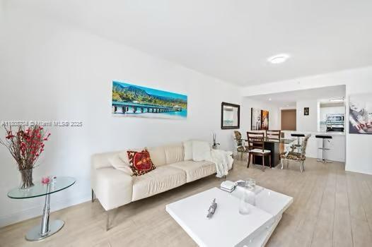 185 SE 14th Ter Unit 1410, Miami, FL 33131 - living room with wood finished floors