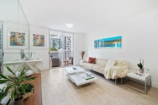 185 SE 14th Ter Unit 1410, Miami, FL 33131 - living area featuring wood finished floors
