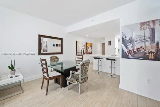 185 SE 14th Ter Unit 1410, Miami, FL 33131 - dining space with light wood-style flooring