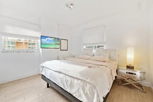 185 SE 14th Ter Unit 1410, Miami, FL 33131 - bedroom with wood finished floors and baseboards