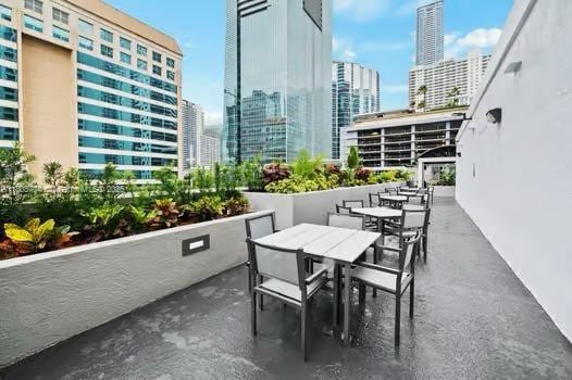 185 SE 14th Ter Unit 1410, Miami, FL 33131 - view of patio featuring a city view and outdoor dining space