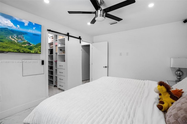 3201 NE 9th Ter, Pompano Beach, FL 33064 - bedroom with recessed lighting, light marble finish floors, a barn door, and a ceiling fan