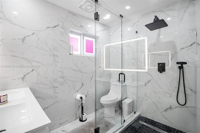 3201 NE 9th Ter, Pompano Beach, FL 33064 - bathroom featuring a marble finish shower, toilet, tile walls, and double vanity