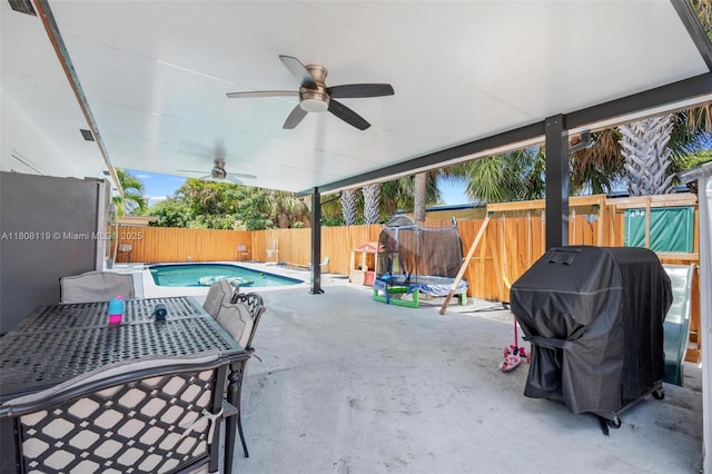 3201 NE 9th Ter, Pompano Beach, FL 33064 - fenced backyard with area for grilling, ceiling fan, and a patio
