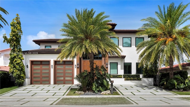 12880 N Bayshore Dr, North Miami, FL 33181 - view of front of house featuring stucco siding and decorative driveway